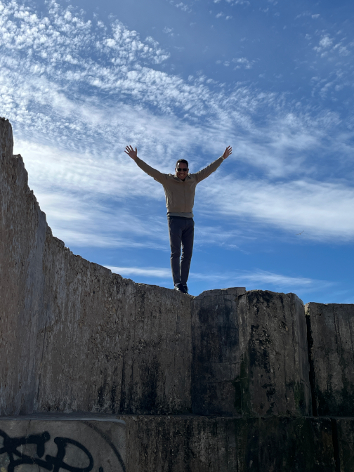 Jamal climbing the sea walls at the port