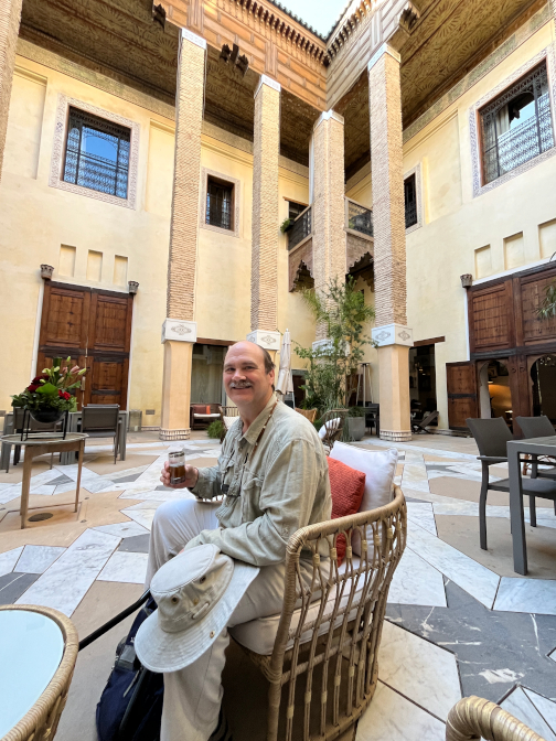 Enjoying mint tea in the courtyard of Karawan Riad