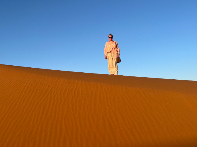 Steph in the dunes at Desert Luxury Camp