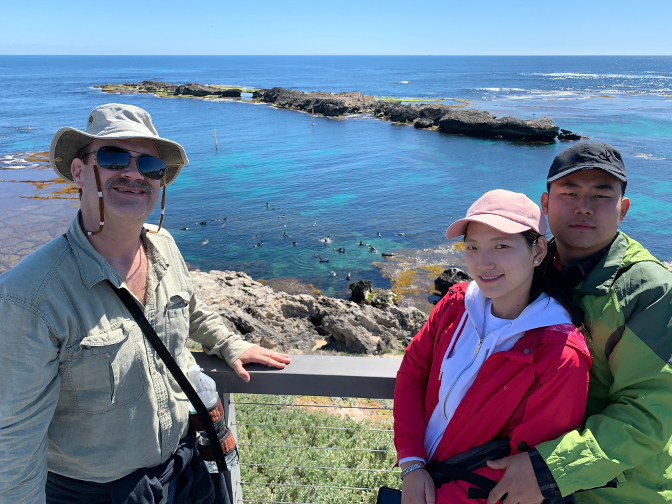 Craig, Sonam Choki, and Sonam Tshering watching NZ fur seals, whales, and dolphins at the West End