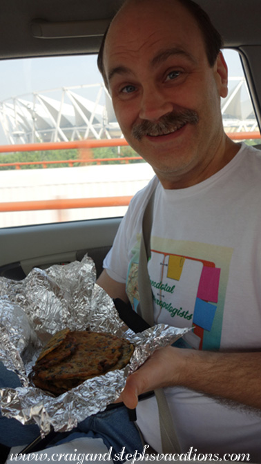 Eating our fenugreek chappathi on the road, thanks to Sunita