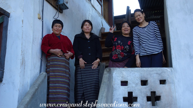 Ama, Phub Phem, Lhaki, and Tshering block our access to the house while they set up a surprise