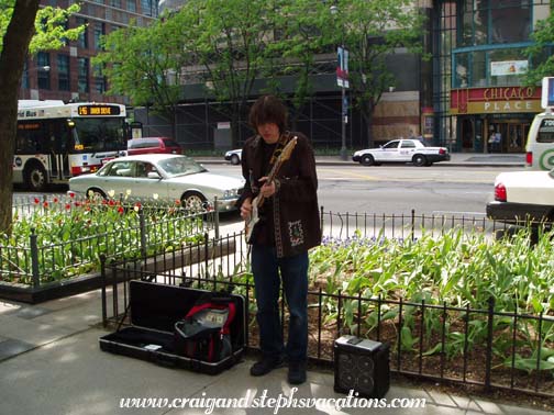 Blues guitarist performing on Michigan Ave