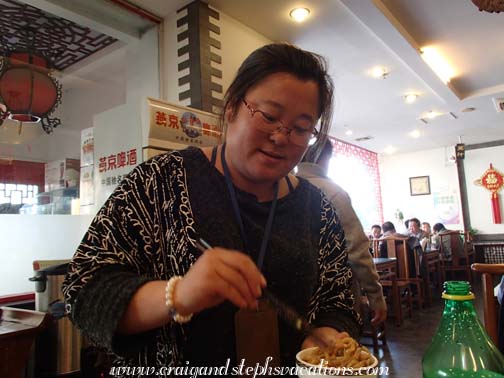 Alice serves us noodles for lunch