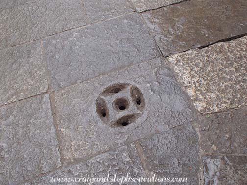 Drains shaped like ancient coins