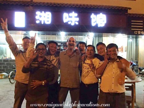 Enthusiastic new friends in front of the restaurant