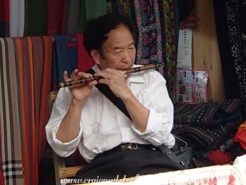 Shopkeeper's father plays the flute