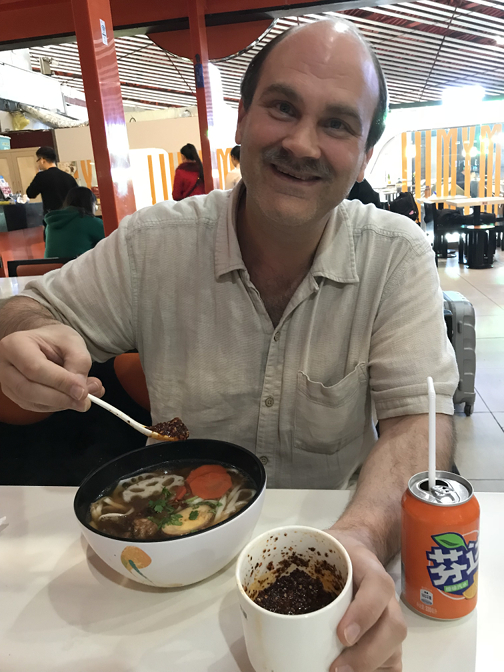 Spicy sirloin noodles and Fanta at My Mill, Beijing Capital Airport