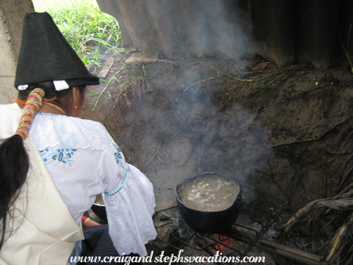 Rosa checks on the mote cooking on the fire