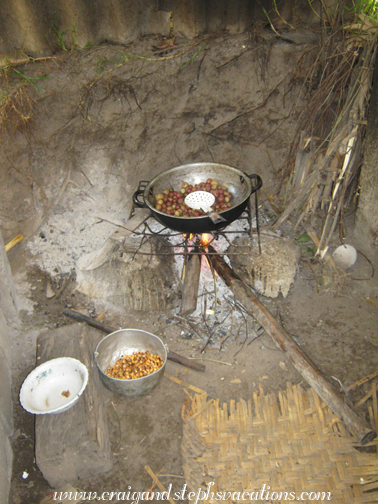 Antonio's mother cooks potatoes on the fire