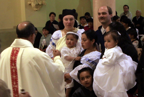 The priest prepares to anoint Sisa (Photo courtesy of Felipe)