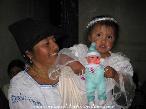 A frosting-covered Sisa and her baby doll