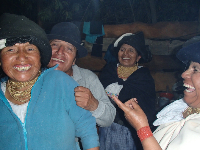 Community members cooking in the outdoor kitchen