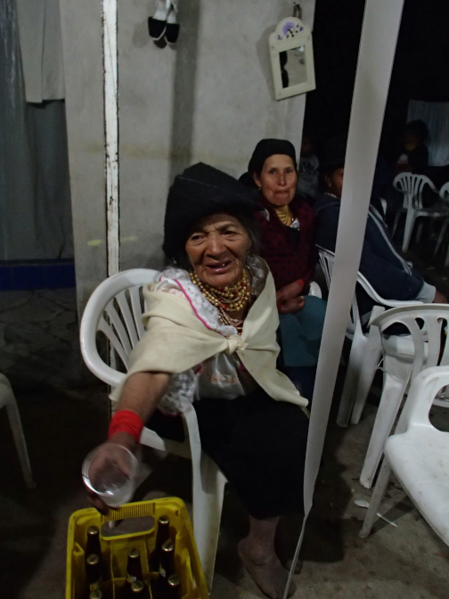 Abuelita splashes an offering to Pachamama