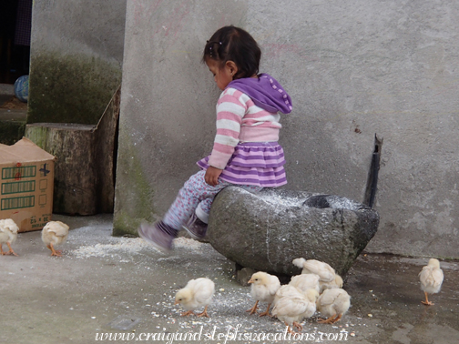 Tayanta sits on the grinding stone