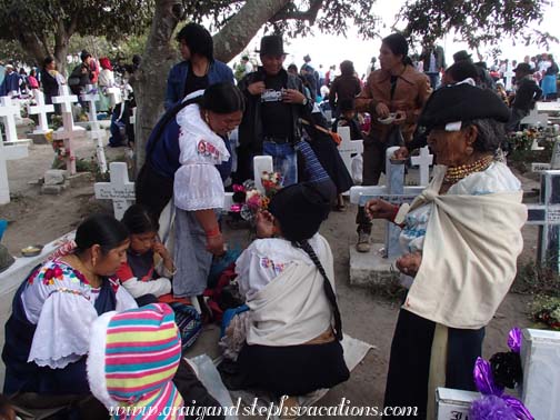 The family gathers in the Kichwa section of the cemetery