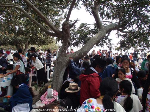 The entire community crowds the indigenous cemetery