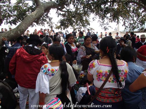 The entire community crowds the indigenous cemetery