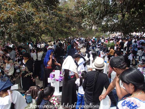 The entire community crowds the indigenous cemetery