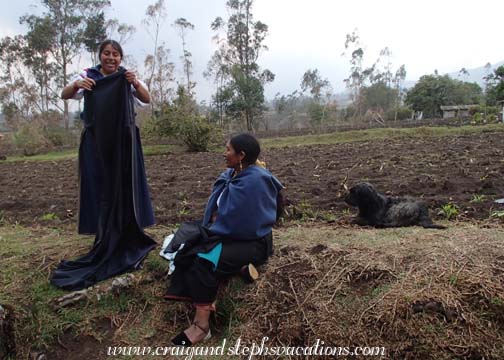 Rosa buying anako fabric from a woman who stopped in with her dog