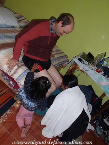 Rosa prepares an herbal bath for Craig's legs