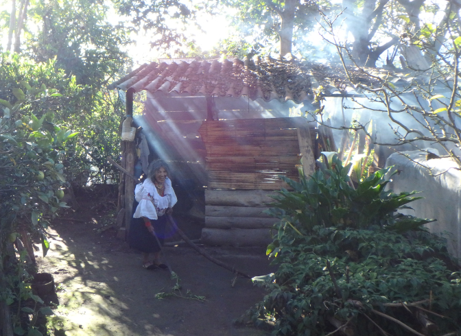 Abuelita in front of her outdoor kitchen