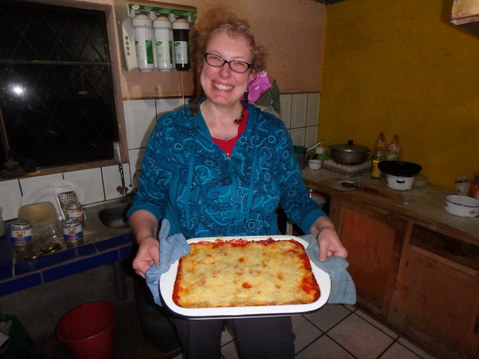 Steph takes the eggplant parm out of the oven