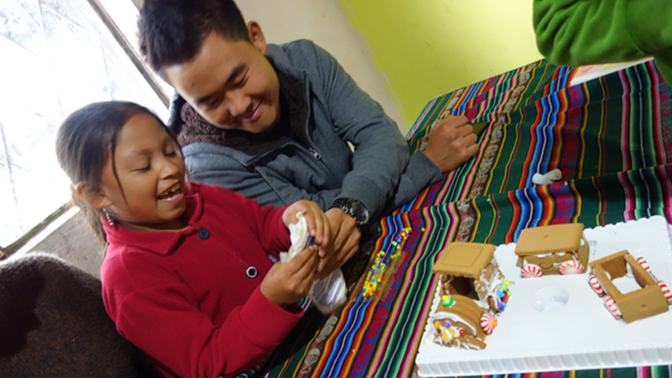 Sisa and Sonam decorate the gingerbread train