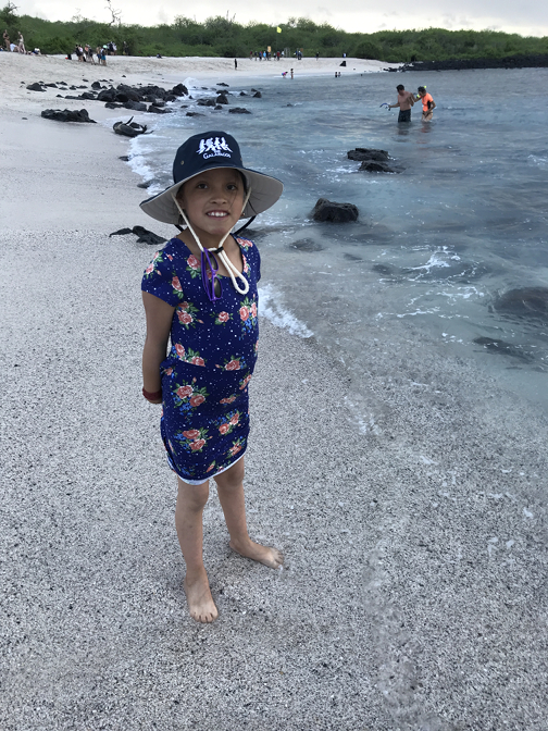 Sisa puts her feet in the ocean for the first time at Punta Carola