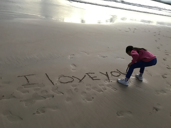 Sisa writes us a note in the sand