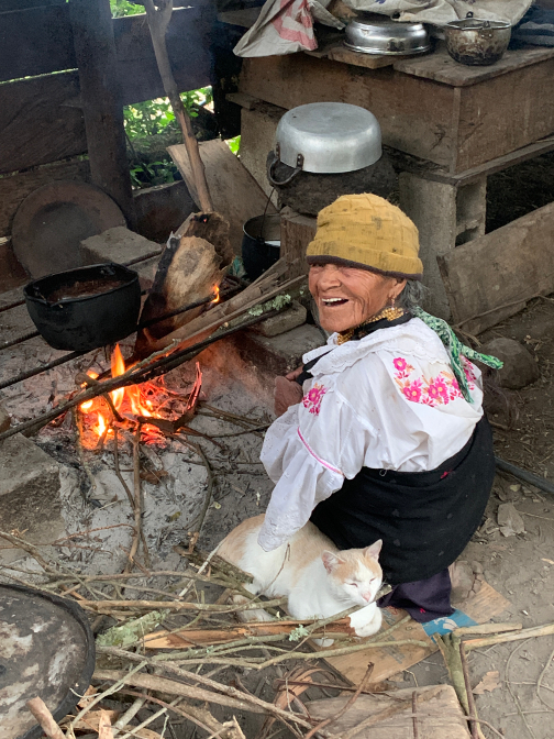 Abuelita and El Se&ntlide;or Chipikins warm themselves by the fire