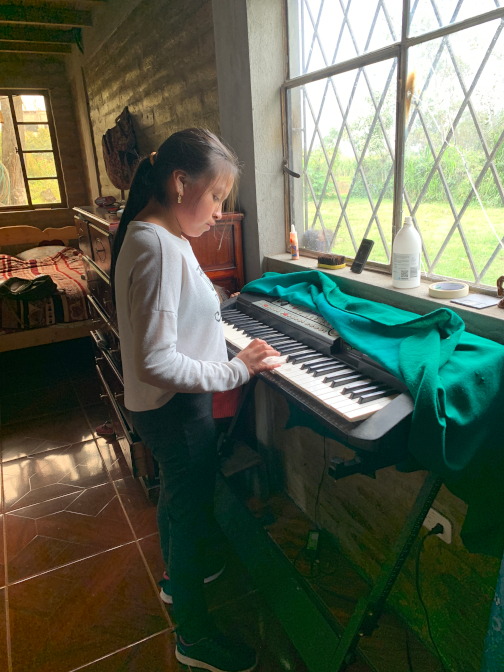 Sisa practicing piano