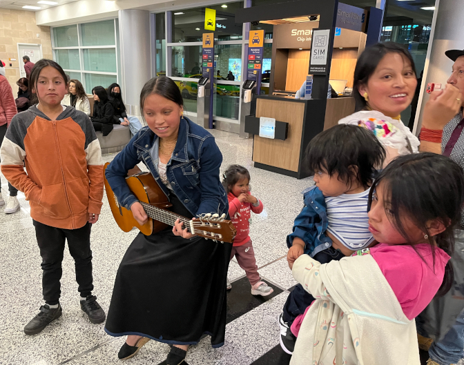 Sisa serenades us on her guitar