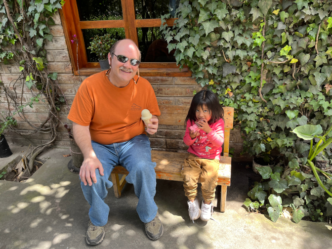 Craig playing ice cream vendor with Nena