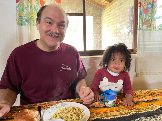 Achi Taita with Kuri at breakfast