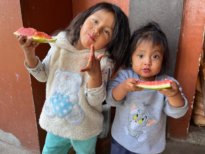 Nena and Kuri enjoying watermelon