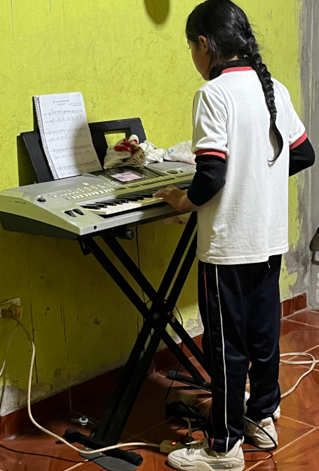 Yupanki practicing piano