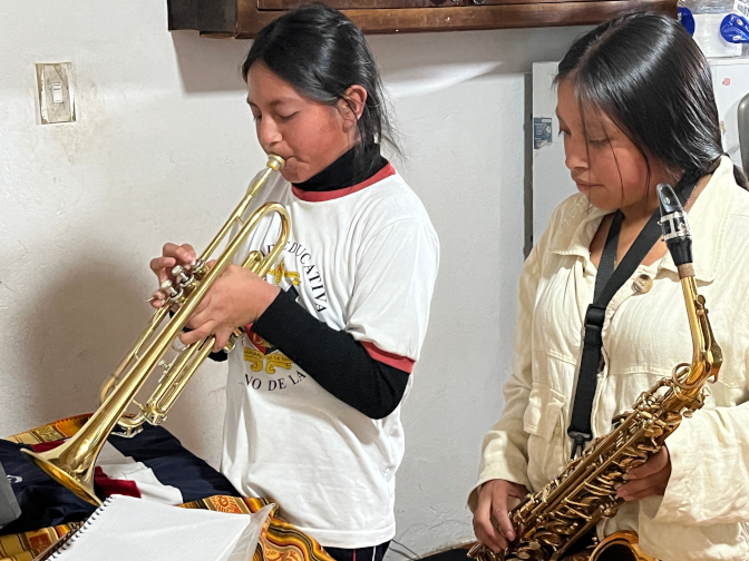 Yupanki and Sisa practicing music together