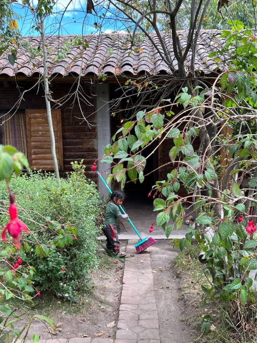 Kuri sweeping the walkway