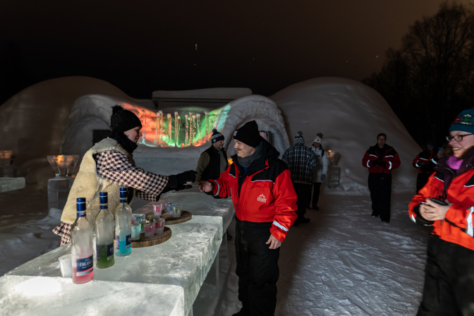 Getting a vodka shot at the ice bar, Snowland Igloo Restaurant