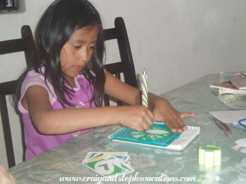 Yoselin plays with the spirograph