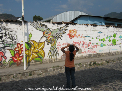 Paola photographing graffiti next to the school