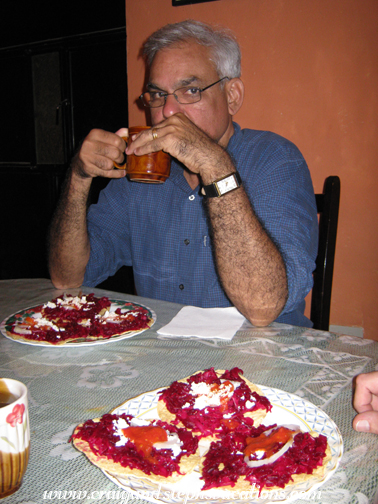 Mukul sips tea at dinner