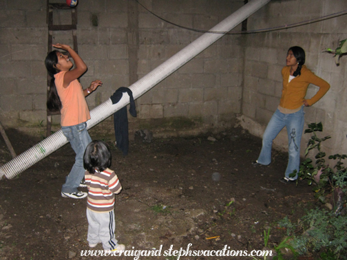 Paola and Vanesa play volleyball while Eddy watches