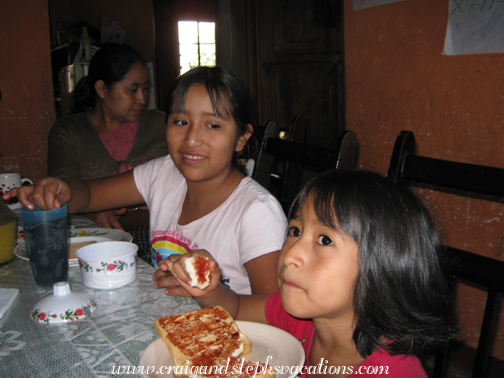 Yasmin and Aracely watch Pocohontas during breakfast