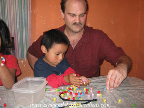 Eddy and Craig stringing beads