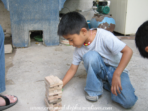 Josue sets up Jenga