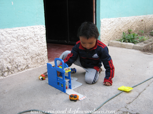 Eddy plays with his Tonka garage