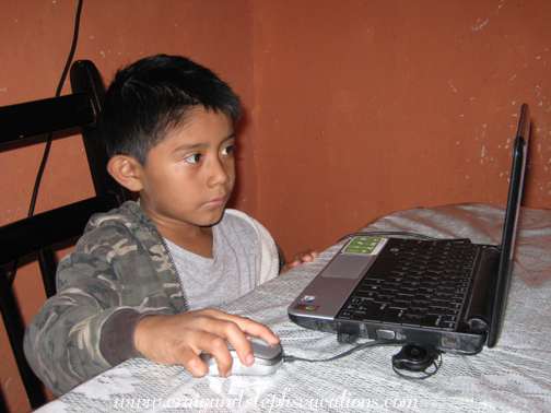 Josue plays on the netbook