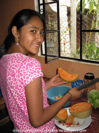 Vanesa cuts canteloupe for ponche